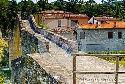 three archs medieval humpback bridge in Italy Stock Photo